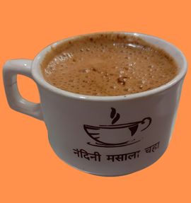 Nandini Masala Chai pack with warm spices around the cup